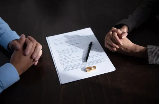 Couple meeting with a divorce mediator to discuss parenting and property issues